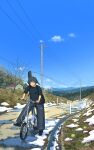  1girl :o backpack bag baggy_pants bare_tree bicycle black_bag black_shoes blue_eyes blue_sky building day grass highres mountainous_horizon natsuno_kanasemi original outdoors pants power_lines puddle riding riding_bicycle road scenery shoes sky sleeves_rolled_up sneakers snow solo spring_(season) tree twintails 