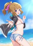  1girl absurdres bikini black_jacket blonde_hair blue_eyes blue_sky blush bow breasts highres hood hooded_jacket idolmaster idolmaster_million_live! jacket long_hair looking_at_viewer medium_breasts ocean open_mouth outdoors outstretched_arm pink_bow ponytail side-tie_bikini_bottom sky smile solo striped_bikini striped_clothes suou_momoko swimsuit tanukiinu005 
