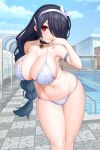  1girl arm_behind_back asamura_hiori bell bikini black_hair blue_archive blue_sky braid breasts building choker cloud collarbone day earrings hair_over_one_eye highres hinata_(blue_archive) jewelry large_breasts long_hair looking_at_viewer mole navel neck_bell outdoors pool poolside red_eyes ribbon single_braid sky solo string_bikini swimsuit very_long_hair white_bikini white_ribbon 
