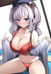  1girl absurdres blue_eyes bra breasts changing_clothes cleavage enishi96 hat highres kantai_collection kashima_(kancolle) large_breasts open_clothes panties red_bra red_panties sitting skindentation thick_thighs thighs thong underwear undressing white_hair 