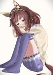  1girl absurdres animal_ears brown_hair buena_vista_(umamusume) cardigan checkered_hairband commentary eakon_7bit ear_covers hair_between_eyes hairband highres horse_ears horse_girl long_hair long_sleeves looking_at_viewer no_shoes pleated_skirt purple_eyes purple_skirt purple_thighhighs school_uniform simple_background sitting skirt solo thighhighs tracen_school_uniform umamusume white_background 