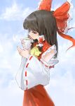  1girl absurdres ascot askeladd6713 bow brown_eyes brown_hair chinese_commentary commentary cup detached_sleeves frilled_bow frilled_hair_tubes frills green_tea hair_bow hair_tubes hakurei_reimu highres holding holding_cup long_hair red_bow red_skirt ribbon-trimmed_sleeves ribbon_trim skirt skirt_set solo steam tea touhou yellow_ascot 