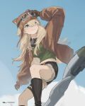  1girl animal_ear_headwear arm_up artist_name aviator_cap black_boots black_shorts blonde_hair blue_sky boots breasts broom broom_riding brown_gloves brown_hat brown_jacket cloud day feet_out_of_frame gloves goggles goggles_on_headwear green_shirt grin hair_between_eyes hand_on_headwear hat highres jacket lilya_(reverse:1999) long_hair looking_to_the_side mask mask_around_neck mechanical_broom medium_breasts midriff open_clothes open_jacket oxygen_mask reverse:1999 rifyaa shirt short_shorts shorts sidesaddle sky smile solo 