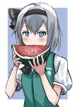  1girl bangs black_bow black_hairband blue_background blue_eyes blush bow collared_shirt commentary_request eating food green_vest grey_hair hair_between_eyes hairband hands_up highres holding holding_food konpaku_youmu looking_at_viewer popsicle ramiki shirt short_sleeves solo touhou two-tone_background upper_body vest watermelon_bar white_background white_shirt 