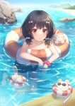  1girl ankle_scrunchie bangs bare_shoulders barefoot black_hair black_shorts blurry blurry_background bow closed_mouth collarbone day granblue_fantasy hair_bobbles hair_bow hair_ornament highres horizon jiman lifebuoy looking_at_viewer medium_hair mouse nose_bubble outdoors partially_submerged red_eyes rock scrunchie shorts smile sparkle vikala_(granblue_fantasy) water wet wet_hair wrist_scrunchie 
