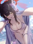  1girl animal_ear_fluff animal_ears bananafish1111 bangs bikini black_hair blue_archive blurry blurry_background blush breasts cape cherry_blossoms cleavage eyeshadow flower fox_ears groin hair_flower hair_ornament halo halter_top halterneck highres large_breasts leaning_forward looking_at_viewer makeup navel ocean open_mouth outstretched_arms petals raised_eyebrows reaching_out solo standing string_bikini swimsuit wakamo_(blue_archive) wakamo_(swimsuit)_(blue_archive) yellow_eyes 