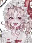  1girl :d blush collarbone drill_hair fangs flandre_scarlet frilled_shirt_collar frills hat highres looking_at_viewer mob_cap red_ribbon ribbon simple_background smile solo touhou white_background white_headwear wrist_cuffs zabu_rou 