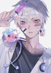  1boy bandage_on_face bandages bangs bishounen blue_eyes bottle_earrings cooling_pad doctor earrings fever heart highres holding holding_syringe injection inuchiru jewelry labcoat looking_at_viewer male_focus pill shirt short_hair sick single_earring solo stethoscope syringe t-shirt thermometer white_background x_x 
