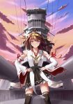  1girl absurdres ahoge battlecruiser boots brown_hair cannon cloud day detached_sleeves double_bun frilled_skirt frills hair_bun hairband hands_on_hips headgear highres japanese_clothes kantai_collection kongou_(battleship) kongou_(kancolle) kongou_kai_ni_(kancolle) long_hair military military_vehicle nontraditional_miko object_namesake outdoors purple_eyes ribbon-trimmed_sleeves ribbon_trim ship skirt sky solo standing thigh_boots turret user_wgvw4555 warship watercraft 