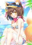  1girl :d animal_ear_fluff animal_ears ball bangs bare_arms bare_legs bare_shoulders beachball bikini blue_archive blue_shorts blue_sky blurry blurry_foreground blush breasts brown_hair cleavage cloud commentary_request day depth_of_field fang feet_out_of_frame flower fox_ears fox_girl fox_tail hair_between_eyes halo highres horizon izuna_(blue_archive) izuna_(swimsuit)_(blue_archive) knees_up looking_at_viewer medium_breasts ocean orange_eyes orange_headwear shikito short_shorts shorts sitting sky smile solo striped striped_bikini swimsuit tail transparent visor_cap water yellow_flower 