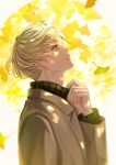  1boy adjusting_collar blonde_hair brown_coat coat day highres leaf long_sleeves looking_up male_focus original outdoors shiraho_(m_shiraho) solo turtleneck upper_body yellow_eyes 