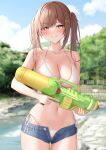  1girl bangs bikini blue_shorts blurry blurry_background blush breasts brown_eyes brown_hair cleavage collarbone commentary_request cowboy_shot hair_ornament highres holding holding_water_gun large_breasts long_hair looking_at_viewer micro_shorts monaka_curl navel original outdoors parted_lips shorts side-tie_bikini solo swimsuit twintails water_gun white_bikini 
