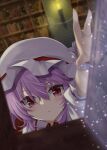  1girl :&lt; akisome_hatsuka bangs blurry blurry_background blurry_foreground book bookshelf closed_mouth collared_shirt commentary dutch_angle foreshortening hair_between_eyes hat hat_ribbon indoors library light_particles looking_at_viewer medium_hair mob_cap purple_hair reaching_out red_eyes red_ribbon remilia_scarlet ribbon shirt solo touhou upper_body white_headwear white_shirt wrist_cuffs 