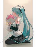  1girl aqua_hair bangs bare_shoulders black_footwear black_pantyhose black_skirt black_sleeves bouquet breasts closed_mouth commentary denpa0304 detached_sleeves flower full_body grey_background grey_shirt hair_between_eyes hair_ornament hatsune_miku highres holding holding_bouquet kneeling long_hair long_sleeves medium_breasts number_tattoo open_mouth own_hands_together pantyhose pillarboxed pink_flower shirt skirt sleeveless sleeveless_shirt smile solo symbol-only_commentary tattoo twintails vocaloid 