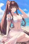  1girl arm_up beach bikini blue_sky breasts brown_eyes brown_hair cherry_blossoms cleavage closed_mouth cloud day detached_sleeves flower hair_flower hair_intakes hair_ornament high_ponytail highres kantai_collection large_breasts light_blush long_hair monoku navel official_alternate_costume outdoors pink_nails sand sandals sarong sitting sky smile solo stomach swimsuit very_long_hair white_bikini yamato_(kancolle) yokozuwari 