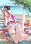  1girl absurdres ass back_tattoo bangs barefoot beach beach_towel bikini bikini_skirt black_bikini blue_nails blurry blurry_background breast_press breasts fake_horns feet_up forehead_jewel frilled_bikini frills from_behind fuwa_gengetsu genshin_impact highres horns long_hair looking_at_viewer looking_back lying medium_breasts nail_polish nilou_(genshin_impact) ocean on_stomach palm_leaf parted_lips red_hair signature skindentation smile soles solo swimsuit tattoo thighlet toenail_polish toenails toes towel veil very_long_hair wet 