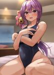  1girl akebono_(kancolle) bangs bed_sheet bell blurry blurry_background blush breasts covered_navel covering covering_breasts embarrassed flower hair_bell hair_between_eyes hair_flower hair_ornament highres kantai_collection kihou_no_gotoku_dmc looking_at_viewer on_bed one-piece_swimsuit open_mouth pillow pink_flower purple_eyes purple_hair school_swimsuit side_ponytail sitting small_breasts solo swimsuit wariza 