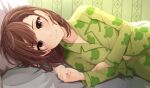  1girl animal_print bangs brown_eyes brown_hair closed_mouth frog_print green_pajamas indoors k3rd long_sleeves looking_at_viewer lying misaka_mikoto on_side pajamas pillow short_hair smile solo toaru_kagaku_no_railgun toaru_majutsu_no_index 