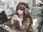  1girl absurdres brown_hair cup elbows_on_table hashimoto_kokai headphones highres holding holding_cup indoors keyboard_(computer) long_hair microphone mug official_art open_mouth original plaid plaid_shirt plant potted_plant shirt solo upper_body wavy_hair 