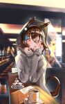  1girl agnes_tachyon_(umamusume) alternate_costume animal_ears bangs blurry blurry_background blush brown_hair chair coffee counter cup elbow_rest grey_hoodie highres hood hoodie horse_ears horse_girl horse_tail indoors looking_at_viewer napkin open_mouth orange_eyes plate shiny shiny_hair sleeves_past_wrists solo sugar_cube table tail umamusume yomean! 