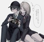  1boy 1girl ahoge akamatsu_kaede black_hat black_jacket black_pants black_shirt black_skirt blonde_hair danganronpa_(series) danganronpa_v3:_killing_harmony feet_out_of_frame hair_ornament hairclip handheld_game_console hat highres holding holding_handheld_game_console jacket long_hair miniskirt monokuma necktie official_alternate_costume pants saihara_shuichi school_uniform shirt sitting skirt speech_bubble striped_necktie sukizukiko thought_bubble translation_request 