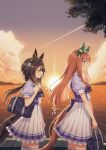  2girls animal_ears back_bow bag blunt_bangs blunt_tresses bow bowtie brown_hair closed_eyes commentary cowboy_shot dusk ear_covers feather_hair_ornament feathers green_eyes grin hair_between_eyes hair_ornament hair_tubes hairband highres hime_cut holding holding_bag horse_ears horse_girl horse_tail long_hair low_ponytail mare_ma mountainous_horizon multiple_girls ocean orange_hair pleated_skirt ponytail puffy_short_sleeves puffy_sleeves purple_bow purple_bowtie purple_shirt sailor_collar sailor_shirt school_bag school_uniform shirt short_sleeves shoulder_bag sidelocks silence_suzuka_(umamusume) single_hair_tube skirt smile stay_gold_(umamusume) striped_clothes striped_hairband summer_uniform sunset tail tail_through_clothes thighhighs tracen_school_uniform umamusume white_hairband white_sailor_collar white_skirt white_thighhighs 