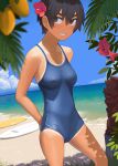  1girl absurdres arms_behind_back bangs beach black_hair blush breasts brown_eyes commentary competition_swimsuit covered_nipples dark_skin flower grin hair_between_eyes hair_flower hair_ornament highres kuronami_(lvi) looking_at_viewer lvi medium_breasts one-piece_swimsuit one-piece_tan original sand short_hair smile solo standing surfboard swimsuit tan tanlines tomboy 