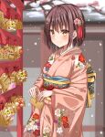  1girl bangs blush brown_hair closed_mouth ema floral_print furisode hatsumoude highres hirorinwelcome japanese_clothes kimono long_sleeves looking_at_viewer new_year original short_hair smile snow solo wide_sleeves winter yellow_eyes 