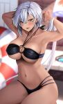  1girl arms_behind_head arms_up bare_shoulders bikini blurry blurry_background breasts brown_eyes collarbone dark-skinned_female dark_skin glasses highres innertube interlocked_fingers kantai_collection large_breasts long_hair looking_at_viewer musashi_(kancolle) musashi_kai_ni_(kancolle) navel o-ring o-ring_bikini parted_lips sitting solo stomach strap_gap swimsuit thighs twintails very_long_hair white_hair yunamaro 