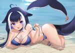  1girl absurdres ahoge animal_ears arm_tattoo arm_under_breasts beach belt belt_collar bikini black_hair blue_bikini blue_collar breasts cetacean_tail chest_tattoo cleavage collar commentary crab eevyart english_commentary facial_tattoo fish_tail halterneck heart heart_ahoge highres indie_virtual_youtuber large_breasts leg_tattoo long_hair looking_at_viewer lying multicolored_hair navel on_side open_mouth orca_girl purple_eyes sand shylily streaked_hair swimsuit tail tattoo thigh_strap undone_bikini virtual_youtuber water wet white_hair 