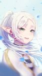 1girl blue_background capelet dangle_earrings earrings elf floating_hair frieren green_eyes jewelry long_hair looking_at_viewer nzz open_mouth petals pointy_ears smile solo sousou_no_frieren twintails upper_body white_capelet white_hair 