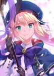  1girl artoria_caster_(fate) artoria_caster_(second_ascension)_(fate) artoria_pendragon_(fate) bangs beret black_gloves blonde_hair blue_bow blue_cape blue_capelet blue_headwear blush bow breasts brown_hair buttons cape capelet closed_mouth commentary_request falling_petals fate/grand_order fate_(series) flower gloves green_eyes hair_ornament hat highres holding holding_staff long_hair long_sleeves looking_at_viewer medium_breasts nishimura_eri petals pink_flower smile solo staff upper_body 