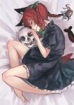  1girl animal_ears barefoot bed_sheet bow braid cat_ears cat_tail dress green_bow green_dress hair_bow highres kaenbyou_rin lying multiple_tails on_side red_hair short_sleeves skull sleeping solo tail touhou twin_braids zeikomi 