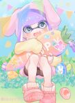  1girl animal_hood bangs black_shorts blue_background easter_egg egg fang head_tilt holding holding_pillow hood hoodie inkling inkling_girl jewelry long_sleeves looking_at_viewer object_hug outdoors pillow pink_footwear pink_hoodie purple_hair rabbit_hood ring short_shorts shorts sitting sleeves_past_wrists smile splatoon_(series) splatoon_2 sticker stuffed_carrot tambarin_inoue 