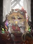  1girl apple ascot blonde_hair crystal crystal_wings eating fang flandre_scarlet food fruit golden_apple hair_between_eyes harumagebon hat hat_ribbon highres indoors looking_at_viewer mob_cap picnic_basket puffy_short_sleeves puffy_sleeves red_eyes red_ribbon red_vest ribbon shirt short_sleeves side_ponytail sitting solo table touhou upper_body vest wings yellow_ascot 