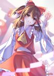  1girl absurdres ascot between_fingers blurry blurry_background bow brown_eyes brown_hair collar depth_of_field detached_sleeves frilled_bow frilled_collar frilled_hair_tubes frilled_skirt frills grin hair_tubes hakurei_reimu hand_up highres holding light_blush long_hair midriff navel ofuda ofuda_between_fingers orb ponytail red_bow red_shirt red_skirt rierurie shide shirt skirt smile solo torii touhou white_collar white_sleeves yellow_ascot yellow_background yin_yang yin_yang_orb 