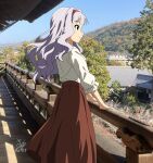  1girl absurdres blue_sky commentary from_behind from_side grey_hair hairband highres idolmaster kirie_dou kyoto long_hair long_skirt long_sleeves nanzen-ji photo_background red_hairband red_skirt shijou_takane shirt signature skirt sky smile solo tree white_shirt 