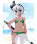  1girl alternate_costume beach bikini black_hairband blurry blurry_background blush border breasts commentary cowboy_shot flat_chest green_bikini green_eyes grey_hair groin hairband halterneck highres hitodama huyusilver konpaku_youmu konpaku_youmu_(ghost) looking_at_viewer navel outdoors see-through_silhouette short_hair small_breasts solo stomach string_bikini swimsuit sword sword_on_back symbol-only_commentary tan tanlines touhou weapon weapon_on_back white_border 