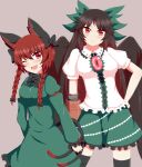  2girls ;d animal_ears arm_cannon black_hair black_wings bow braid cape cat_ears contrapposto green_bow green_skirt hair_bow highres kaenbyou_rin long_hair multiple_girls multiple_tails one_eye_closed red_eyes red_hair reiuji_utsuho seo_haruto skirt smile tail thighhighs third_eye touhou twin_braids weapon wings 