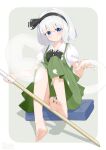  1girl absurdres barefoot black_bow black_bowtie black_hairband blue_eyes blush bow bowtie chinese_commentary closed_mouth collared_shirt commentary_request green_skirt green_vest grey_hair hairband highres hitodama hitodama_print holding holding_sword holding_weapon konpaku_youmu konpaku_youmu_(ghost) puffy_short_sleeves puffy_sleeves shadow shirt short_sleeves sitting skirt skirt_set soles solo sword toes touhou vest weapon white_shirt wooden_sword wrainman 