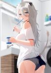  1girl absurdres animal_ears ass black_choker blurry blurry_background breasts c1p122 choker cowboy_shot cup cutoffs drink ear_piercing fingernails grey_eyes grey_hair hair_between_eyes highres holding holding_cup hololive indoors large_breasts lion_ears lion_girl lion_tail long_hair looking_at_viewer looking_back loose_clothes loose_shirt mouth_hold piercing sharp_fingernails shirt shishiro_botan short_shorts short_sleeves shorts single_bare_shoulder solo standing tail toothbrush_in_mouth virtual_youtuber white_shirt 