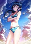  1girl bare_shoulders beach bikini blue_bikini blue_hair blue_sky blush breasts buckle_(artist) cleavage closed_mouth cloud cloudy_sky collarbone commentary_request crossed_arms day green_bikini highres large_breasts long_hair looking_at_viewer love_live! love_live!_sunshine!! matsuura_kanan micro_bikini navel ocean outdoors purple_eyes sky solo stomach striped_bikini striped_clothes swimsuit two-tone_swimsuit wet 
