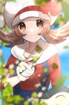  1girl absurdres blue_overalls bow brown_eyes brown_hair cabbie_hat cyndaquil hat hat_bow highres holding holding_poke_ball kurumiya_(krmy_p) leaf looking_at_viewer lyra_(pokemon) overalls poke_ball pokemon pokemon_(creature) pokemon_(game) pokemon_hgss red_bow red_shirt shirt smile twintails twitter_username white_headwear 