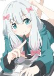  1girl absurdres aqua_eyes aqua_jacket bangs blush bow closed_mouth commentary crossed_legs cynical_(llcbluckg_c004) drawing_tablet eromanga_sensei feet_out_of_frame grey_hair hair_between_eyes hair_bow highres holding holding_stylus hood hood_down izumi_sagiri jacket legs_up long_hair long_sleeves looking_at_viewer low-tied_long_hair lying on_stomach pink_bow simple_background smile solo stylus twitter_username white_background 
