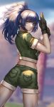  1girl absurdres adjusting_clothes adjusting_gloves ass black_gloves blue_eyes blue_hair blurry blurry_background earrings gloves green_jacket green_shorts highres hua-j jacket jewelry leona_heidern looking_at_viewer military military_uniform ponytail shorts snk solo the_king_of_fighters the_king_of_fighters_xv triangle_earrings uniform 