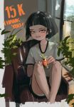  1girl :d absurdres armchair bangs black_hair black_shorts blunt_bangs blush chair cup drinking_glass fang feet_on_chair grey_shirt highres holding holding_cup looking_at_viewer milestone_celebration original polilla shirt short_hair short_sleeves shorts sitting smile solo window yellow_eyes 