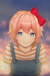  1girl absurdres arms_behind_back bangs bloom blue_eyes blue_overalls blurry blush bokeh bow buttons commentary depth_of_field doki_doki_literature_club grin hair_between_eyes hair_bow hair_ornament happy highres infinitysideddie leaning_forward looking_at_viewer outdoors overalls pink_hair red_bow sayori_(doki_doki_literature_club) shirt short_hair smile solo striped striped_shirt t-shirt upper_body 