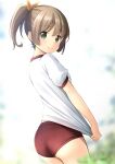  1girl ass bangs blurry blurry_background blush brown_hair buruma closed_mouth clothes_pull commentary_request day depth_of_field from_behind green_eyes gym_shirt gym_uniform hair_between_eyes hair_ribbon highres looking_at_viewer looking_back original outdoors ponytail puffy_short_sleeves puffy_sleeves red_buruma ribbon shibacha shirt shirt_pull short_sleeves smile solo white_shirt yellow_ribbon 