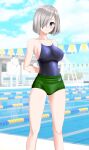  1girl absurdres alternate_costume arms_behind_back blue_eyes blue_one-piece_swimsuit blue_sky breasts buruma cloud commentary_request competition_school_swimsuit day feet_out_of_frame green_buruma grey_hair hair_ornament hair_over_one_eye hairclip hamakaze_(kancolle) highres kantai_collection lane_line large_breasts looking_at_viewer outdoors parted_lips pool school_swimsuit short_hair sky solo string_of_flags swimsuit swimsuit_under_clothes takafumi 