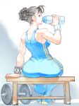  1girl arm_scrunchie barbell bench birokichi00 blue_unitard bottle bracelet brown_hair chun-li double_bun hair_bun highres jewelry looking_back solo spiked_bracelet spikes street_fighter toned unitard water_bottle 